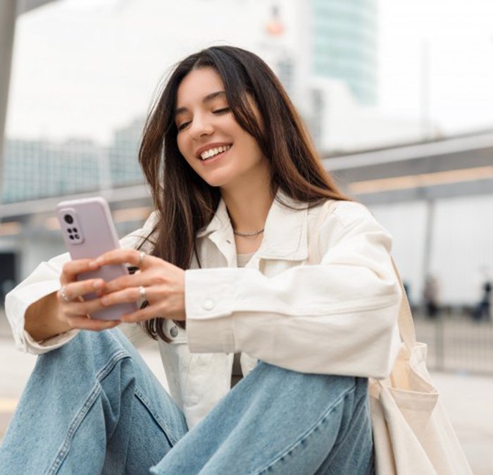 Lady reads something on phone?