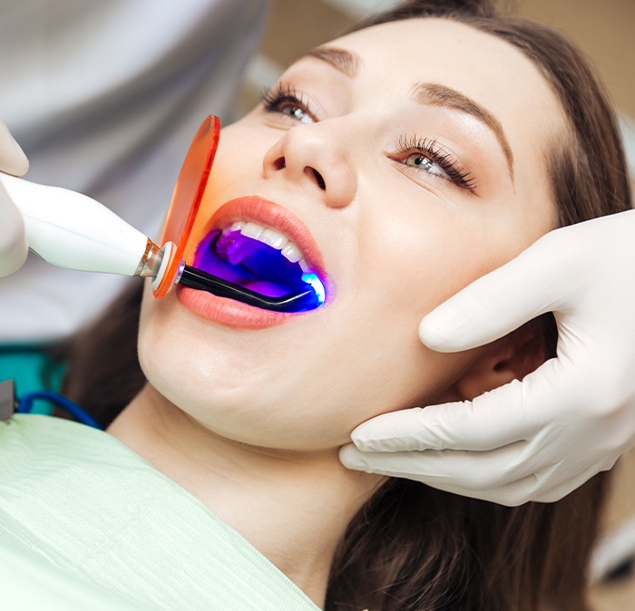 Woman receiving dental bonding treatment