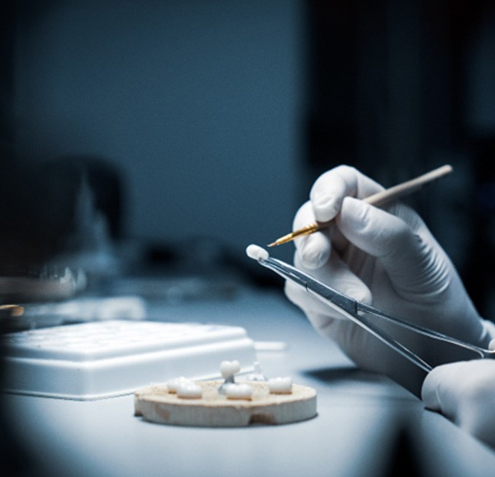 a dental lab tech making a crown