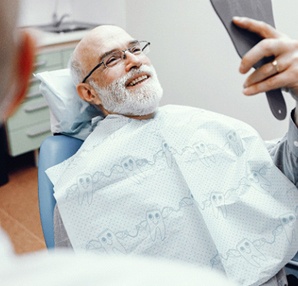 Man smiling after checkup in Houston