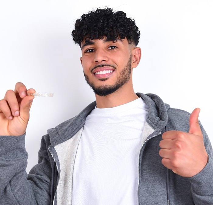 teenager happy with Invisalign in Houston 