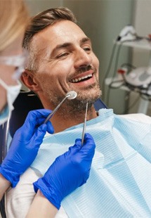 a patient undergoing dental care near Fourth Ward