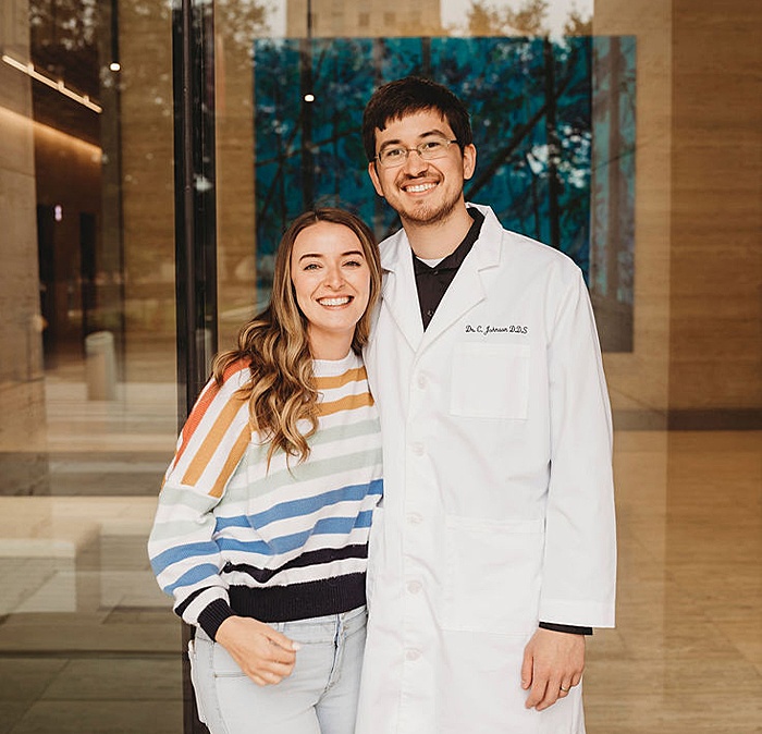 Doctor Johnson and dental patient smiling together