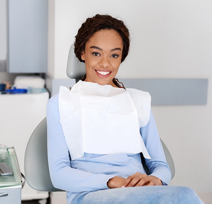 Woman in dental chair for preventive dentistry checkup and teeth cleaning