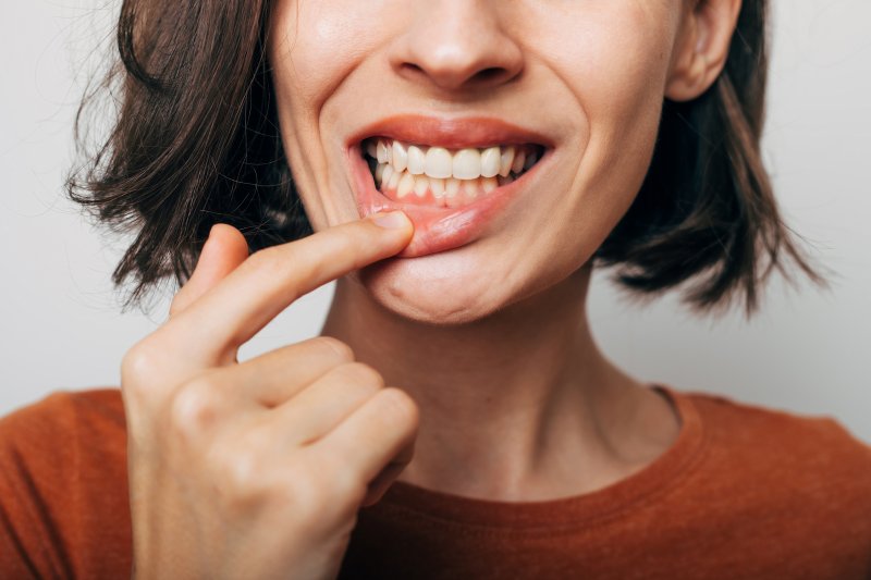 woman demonstrating gum disease myths in Houston