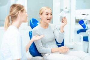 Woman admiring her cosmetic dentistry results