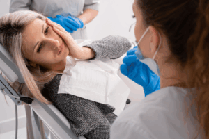 a patient dealing with urgent dental pain